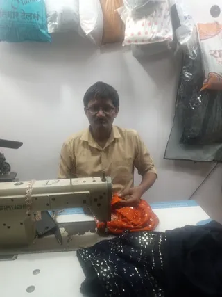 UMAR TAILOR — photo 1